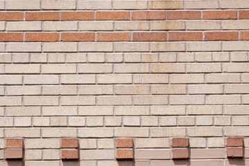 decorative brick wall with two-tone geometric pattern in terra cotta and beige, art deco style background