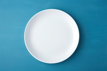 Perfectly white ceramic plate on a clean wooden table, ready for a meal.