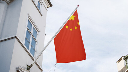 China flag in front of top of the building
