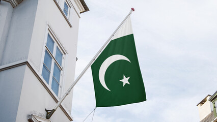 pakistan flag in front top of the building