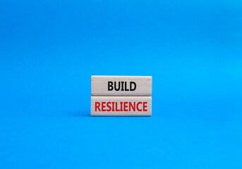 Build resilience symbol. Wooden blocks with words Build resilience. Beautiful blue background. Business and Build resilience concept. Copy space.