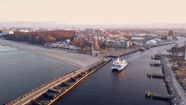 Sailing Elegance: Catamaran Jantar's Winter Odyssey from Kolobrzeg Harbor, Poland.