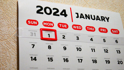 Close-up of a beautiful January page of the wall calendar 2024 with a red cursor on the New year's...