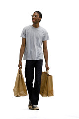A man in a gray T-shirt, on a white background, with bags