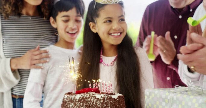 Birthday party song, cake and happy family child celebrate, excited and people singing for candles at event. Grandparents, parents and young kid smile for celebration, applause and congratulations