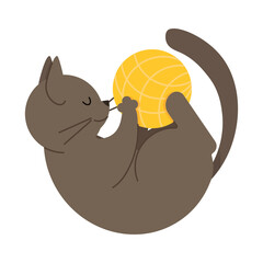 Cute gray cat lies playing with a yellow ball of thread