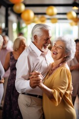 Happy elderly couple dancing at a party