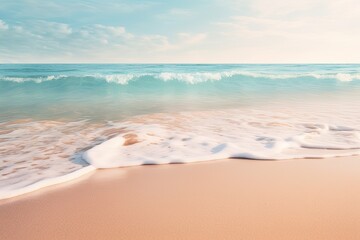 Fototapeta na wymiar A close-up shot of gentle waves caressing the shore on a pristine sandy beach
