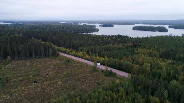 Caravan Camping driving on E45 Higway Road through the wilderness of middle Sweden between the towns of Malung and Oje