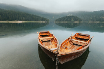 Wooden Rowing Boats on Morning Mountain Lake