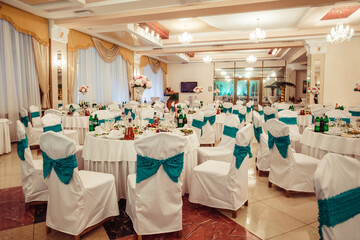 Decorated wedding banquet hall in classic style. Restaurant interior for banquet, wedding decor. 