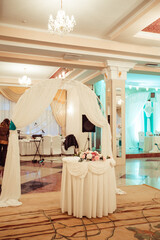 Decorated wedding banquet hall in classic style. Restaurant interior for banquet, wedding decor. 