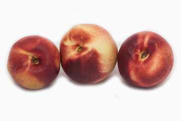 Three red nectarines