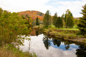 Scenic views of autumn colours along the North River, Quebec.