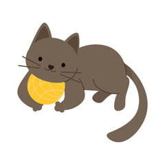 Cute little kitten lies next to a yellow ball of yarn