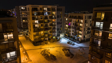 Drone photography of multistory houses in a city during night © M