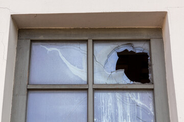 Broken glass window outside