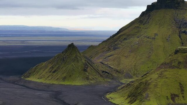 4k Drone footage of iceland volcano aerial flyby of green mountains with moss. Highlands of Iceland in Thakgil.