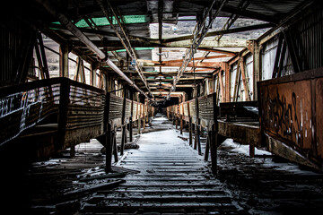 Rusty dilapidated assembly line of an old closed factory in Eastern Europe