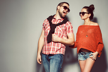 Stylish pregnancy & family concept: portrait of funny couple of hipsters (husband and wife) in...