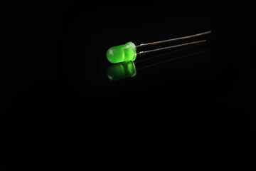 Isolated single green Light Emitting Diode (led) on a the black.