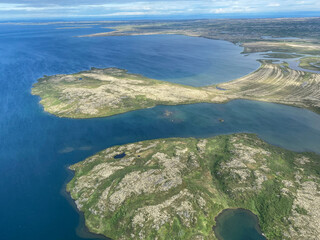 Aerial view of Lake Iliamna with islands, Aleutian mountain range and reflection. Near Pedro Bay, Alaska. 