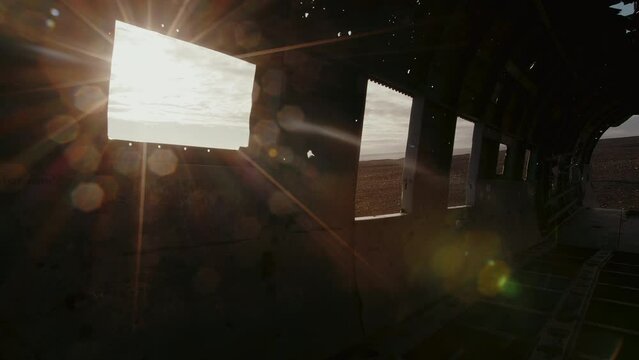 Sun shines through the window of a plainwreck, flair at the interior, Iceland, Solheimsandur