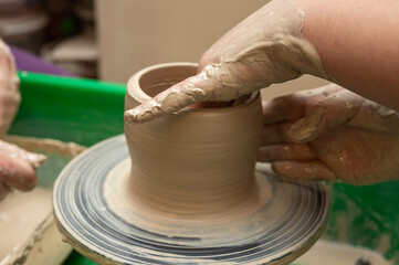 Clay, pottery or hands in designer workshop working on an artistic cup or mug mold in small business studio. Hand of creative artist or worker manufacturing handicraft products in sculpture