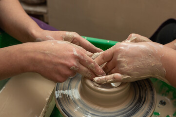 Clay, pottery or hands in designer workshop working on an artistic cup or mug mold in small business studio. Hand of creative artist or worker manufacturing handicraft products in sculpture