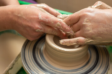 Clay, pottery or hands in designer workshop working on an artistic cup or mug mold in small business studio. Hand of creative artist or worker manufacturing handicraft products in sculpture