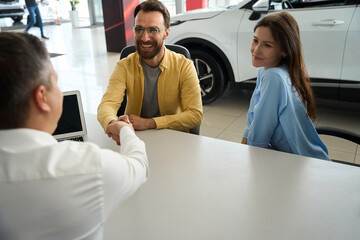 Married couple communicates with a consultant in the office area