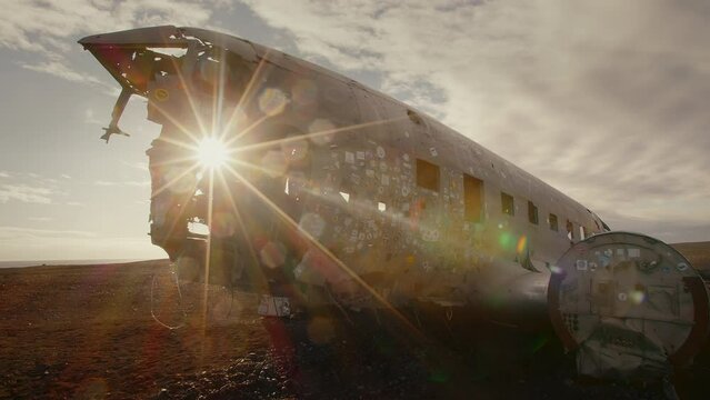 Sun shines through the window of a plainwreck, flair, entire plain, Iceland, Solheimsandur