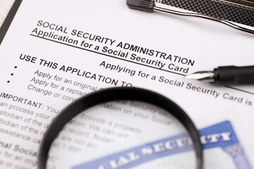 United States social security number cards lies on Application from social security administration...