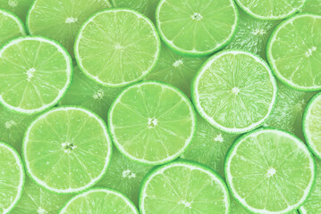 Fresh lime slices as a background.