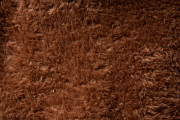 Texture of a brown faux fur as a background.