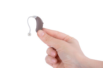 Hearing aid device in hand isolated on transparent png background with clipping paths. Deaf ear...