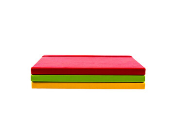 Textured paper notebooks in yellow, red and green color planner isolated on transparent png background. Design template of copybook with elastic band for mockup. Top view.