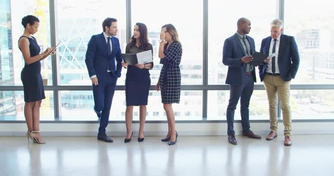 Business people, window and documents for networking, talking and planning with discussion, tablet and chat. Men, women and preparation for workshop, proposal or development process at job in lobby