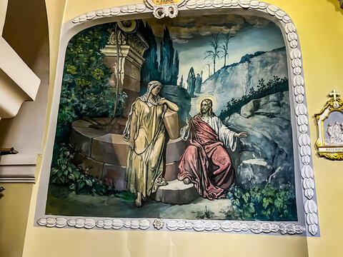 Hrubieszow, Poland, September 4, 2023: Sanctuary of Our Lady of Consolation, Sokalska in Hrubieszow, Poland. Fragment of the interior, fresco "Meeting with the Samaritan woman at the well"