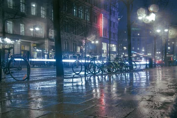 Fototapete Rund a view of a city street in the rain © niklas storm