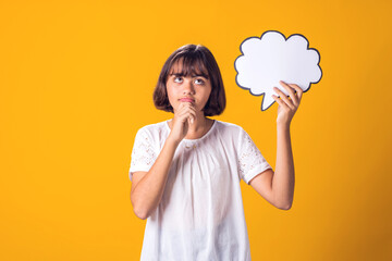 Child girl holding think cloud bubble card. Dreaming concept