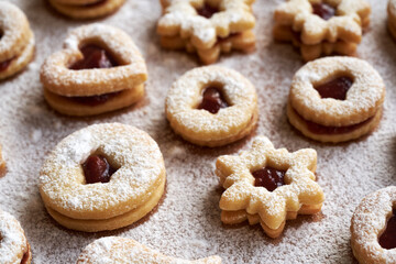 Linzer Christmas cookies filled with marmalade and dusted with sugar