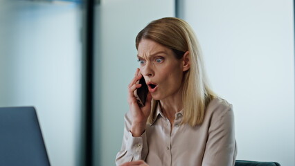 Nervous manager shouting smartphone at work closeup. Furious woman arguing call