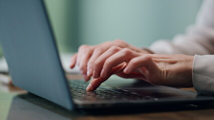 Lady hands texting laptop keyboard office closeup. Unknown businesswoman working