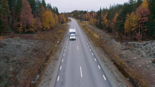 Caravan Camping driving on E45 Higway Road through the wilderness of middle Sweden near the town Lomsele
