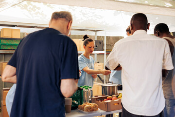 Image showcasing homeless people receiving warm meals and necessities from generous volunteers....