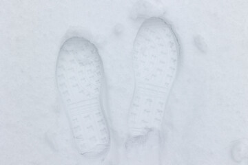 Footprints in the snow. Shoe imprint.