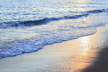 Beautiful view of the sea and sky. Sea water background. Blue ocean background. Clear sea water. Vacation and summer concept. Landscape. Powerful Ocean blue waves with white foam. Stormy ocean