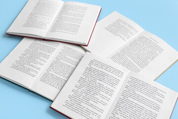 Obraz premium Open books on blue background