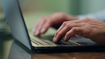 Businessman hands working computer keyboard indoors close up. Boss typing laptop